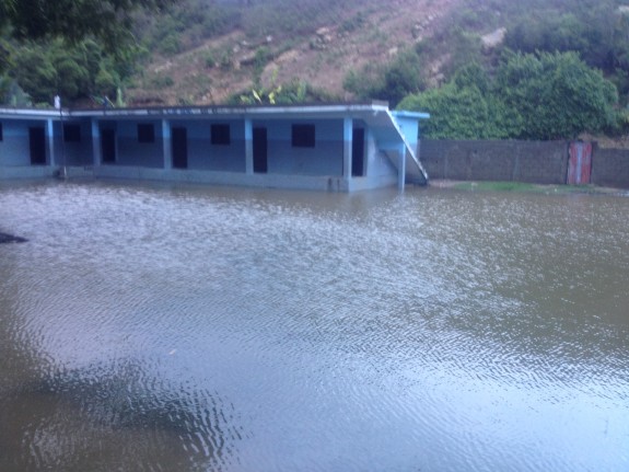 Flooded schoolyard adjacent to the clinic at Bod me Limbe.